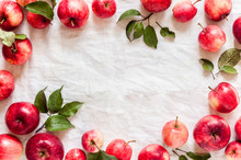 Red Apples On White Fabric