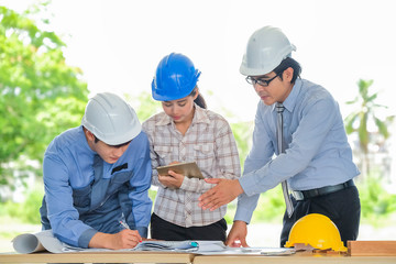 Asian engineers were consulted together and plan in construction