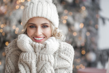 Beautiful Blond Woman On Christmas Background. Beauty Near Cristmas Tree. Close Up Portrait Of Attractive Female.
