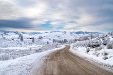 Old Dirt Road In A Barren Mountainous Winter Wonderland: Snow-covered Countryside Of The Methow Valley After Sunset - Washington, USA