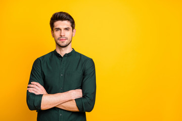 Wall Mural - Portrait of gorgeous chic guy worker cross his hands feel serious ready solve start-up problems real expert wear casual style outfit isolated over yellow color background