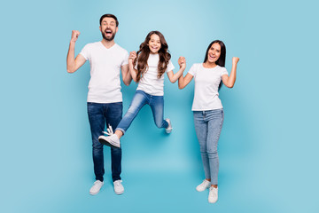 Wall Mural - Full length photo of funky three mom dad mommy daddy kid brown hair have party triumph raise fists scream yeah wear white t-shirt denim jeans sneakers isolated over blue color background