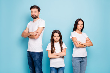 Poster - Portrait of disappointed beautiful mad family with brunet hair have communication problem trouble wear white t-shirt denim jeans isolated over blue color background