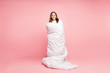 Full length body size view of her she nice attractive cute cheerful cheery wavy-haired pre-teen girl standing wrapped covered in soft white blanket isolated over pink pastel color background