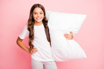 Poster - Photo of wavy cheerful hispanic brunette positive preteen embracing her soft pillow wearing white t-shirt trousers smiling toothily isolated pastel color background