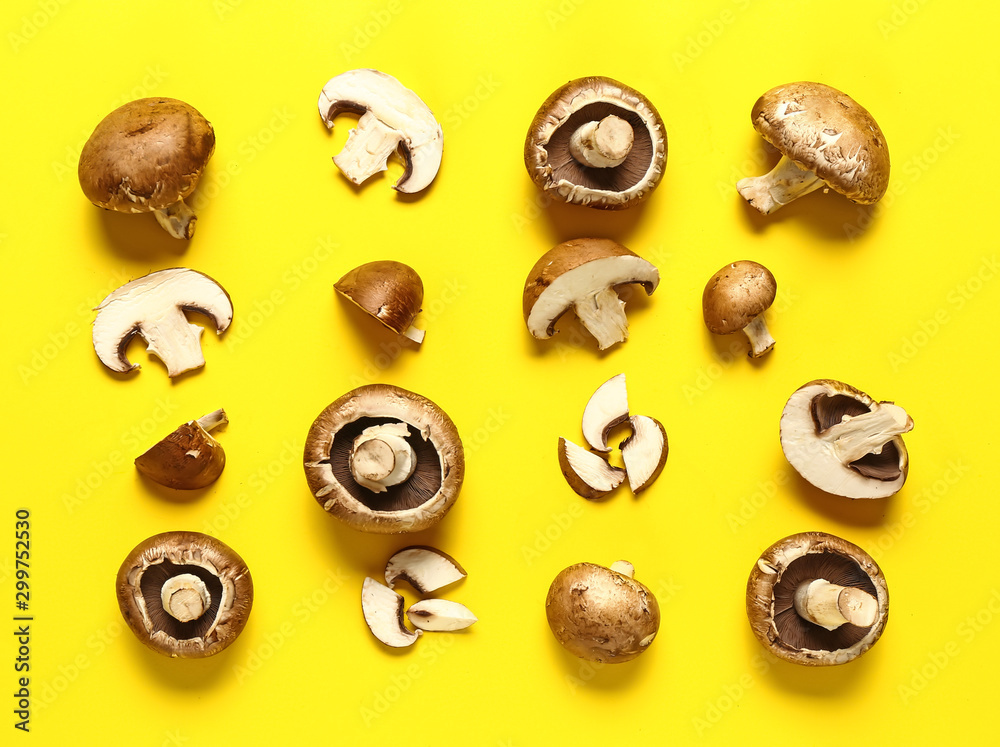 Fresh champignon mushrooms on color background