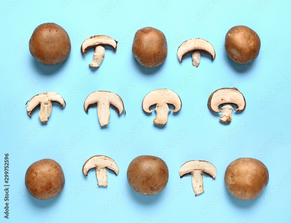 Fresh champignon mushrooms on color background