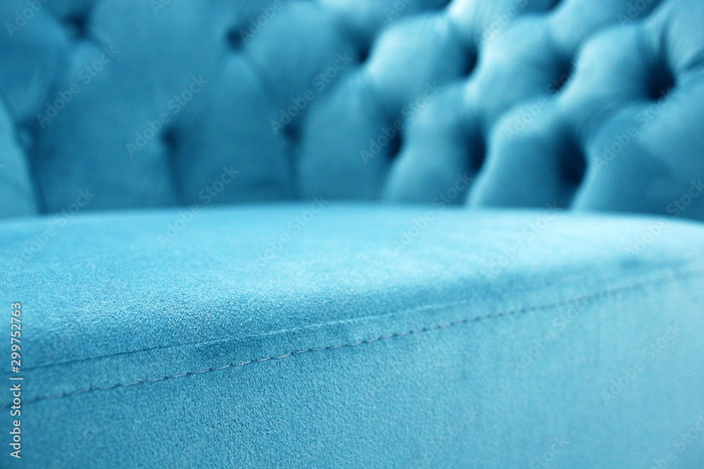 Detail of classical furniture, selective focus. Velour sofa close-up with part of the seat. Turquoise padded fabric upholstery of the sofa. Turquoise velvet with buttons on the upholstered furniture. - obrazy, fototapety, plakaty 