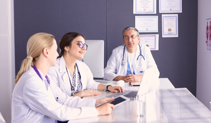 Wall Mural - Doctors having a medical discussion in a meeting room