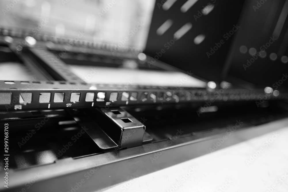 Assembly of a server data cabinet within a factory location showing the ...