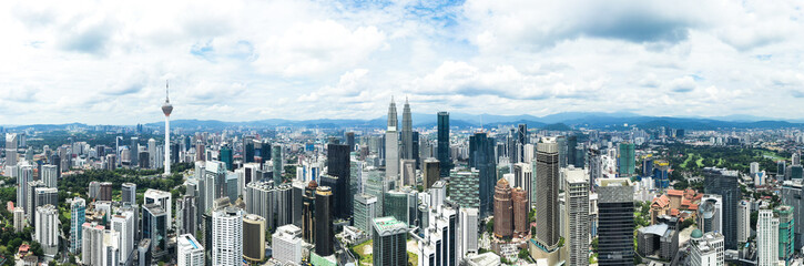  View from above, stunning panoramic view of the Kuala Lumpur skyline during a cloudy day. Kuala Lumpur commonly known as KL, is the national capital and largest city in Malaysia.