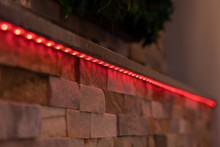 Red LED Stripe On A Wall In The Living Area