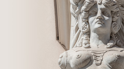 Banner of Ancient wall sculpture of a sensual woman warrior Amazonian in chain armor as defender in downtown of Dresden, Germany, details, closeup, paste space