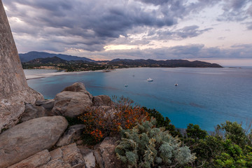 Wall Mural - Aerial panoramic view of the beach and sea with azure turquoise crystal clear water, mountains in the background, in Villasimius, Sardinia (Sardegna) island, Italy. Holidays, best beaches in Sardinia.