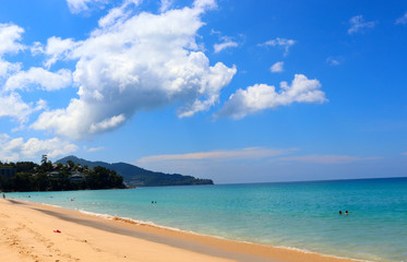 Wall Mural - view of patong beach in phuket, sea waves roll on the sandy shore, foam and spray of water