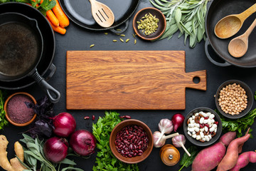 Dark culinary background with healthy food ingredients