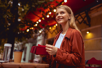 Canvas Print - Smiling modern lady looking into the distance