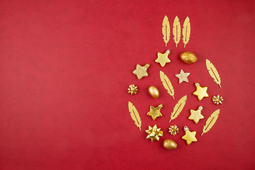 Wall Mural - Christmas decoration with xmas golden ornaments with copy space over the red background