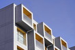 details of a new apartment building on a Sunny day. modern construction of houses, contrast of buildings