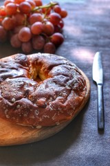 must donut with grapes in the background