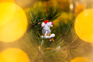 Little mouse toy, symbol of Chinese happy new 2020 and new year decoration. Horoscope sign 2020. New Year 's 2020 Symbol. Greeting Christmas card. Front view. Selective focus.