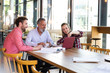 © Westend61 - Casual business people having a meeting in a cafe