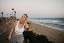 Happy Young Woman On The Beach, Huntington Beach, California, USA