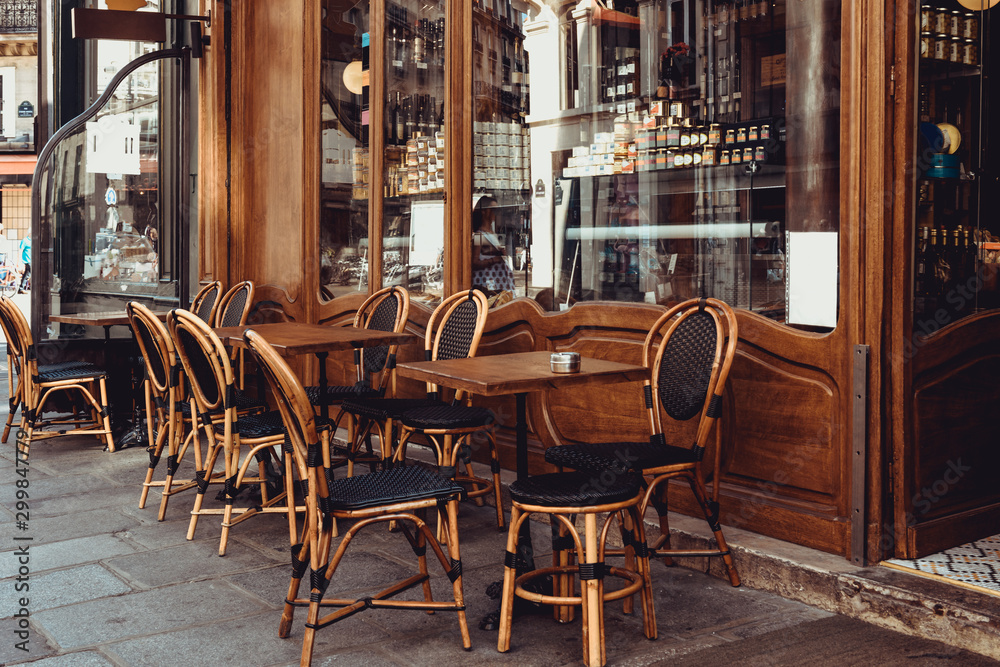 Cozy street with tables of cafe in Paris, France - obrazy, fototapety, plakaty 