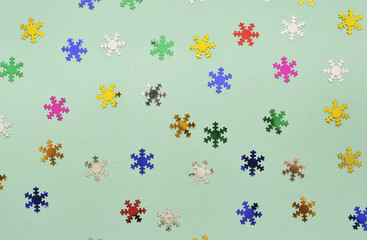 Wall Mural - Festive background. Colorful glitter stars on mint color background.