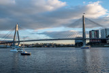 Fototapeta Mosty linowy / wiszący - bridge and yacht in the morning light