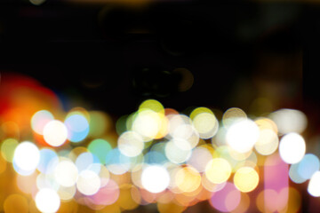 Wall Mural - Abstract colorful bokeh and blurred reflection lighting on black background