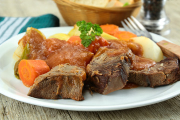 Wall Mural - plate of pot au feu (french cuisine) on a table