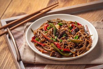 Wall Mural - Soba noodles with vegetables and beef, asian style cuisine.