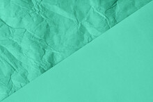 Crumpled And Plain Paper Sheets Divided Diagonaliy Creating Line Partition. Trendy Mint Colored Abstract Background Design. Flat Lay, Copy Space. Year Color Concept.