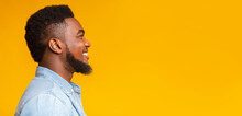 Profile Portrait Of Cheerful Bearded Black Guy On Yellow Background
