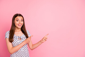Wall Mural - Photo of attractive cute nice girl showing two forefingers at once at something that is definitely worth your attention while isolated with vivid background