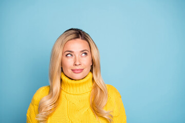 Sticker - Closeup photo of amazing pretty blond lady looking wondered empty space have crazy idea wear warm knitted yellow jumper isolated blue color background