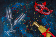 Glasses Of Champagne, Mask And Confetti 