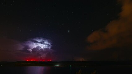 Wall Mural - fantastic starry sky during a thunderstorm. scenic footage of magic astro photography.