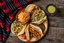 Mexican Stew Tacos Also Called "guisados" With Rice On Wooden Background