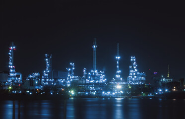 Oil refinery plant at night.