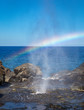 Spout of water with rainbow at Nakalele blowhole, Maui, Hawaii
