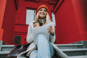 Wall Mural - Young female student girl with copybook and coffee