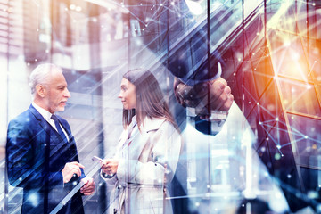 Wall Mural - Handshaking business person in office. concept of teamwork and partnership. Double exposure