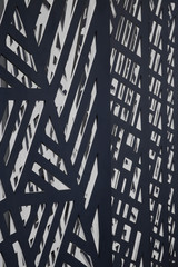 Poster - Metal grid structure with lights and shadows. Abstract modern industrial architecture or technology photo featuring irregular polygonal pattern of multiple frames.