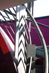 Poster - Steel balustrade and handrails of staircase in an industrial building. Modern architecture fragment in vivid colors with shadows cast by metal grid.