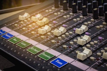 Slide the volume of the audio mixer on the console in the recording and editing work.