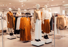 White Mannequins In Autumn Warm And Cozy Clothes In A Store In The Mall.