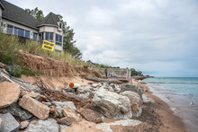 Beach Houses On Lake Michigan, Lake Erosion Dangerously Close To Houses, Half The Beach Is Gone Due To High Water