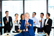 © NVB Stocker - business teamwork concept. Group of business people with businessman leader on foreground